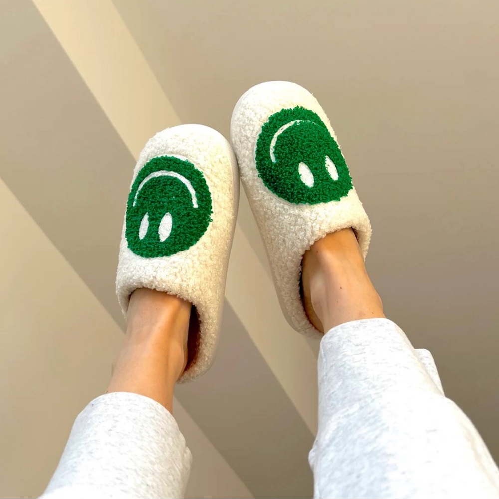 Green smiley face slippers